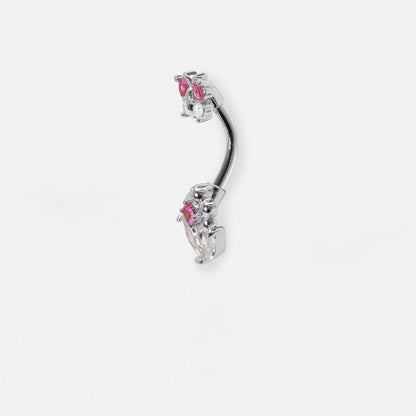 Side image of a Steel navel belly bar with a butterfly top and a flower design with clear and pink fuchsia crystal gemstones by Kingsley Ryan Wholesale