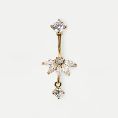 A gold-plated belly button ring featuring a vertical barbell with a starburst cluster of clear marquise and round crystals at the center, and a dangling clear crystal cluster at the bottom, shown on a light gray background.