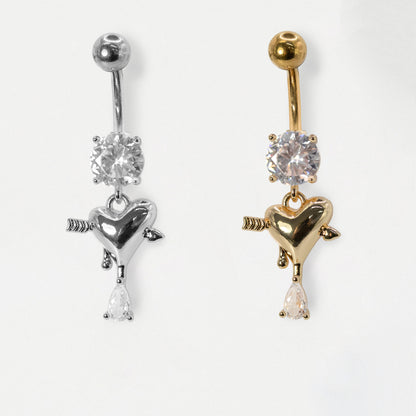 316L Grade Steel and Gold PVD Steel belly bars featuring a round clear crystal solitaire and an arrow-pierced heart charm dangle with a pear crystal drop by Kingsley Ryan Wholesale