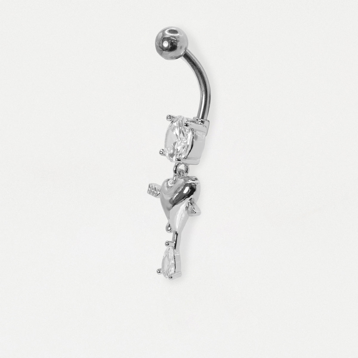 A Steel belly bar from the side showing the heart dangle and pear crystal charm from the Kingsley Ryan wholesale body jewellery collection