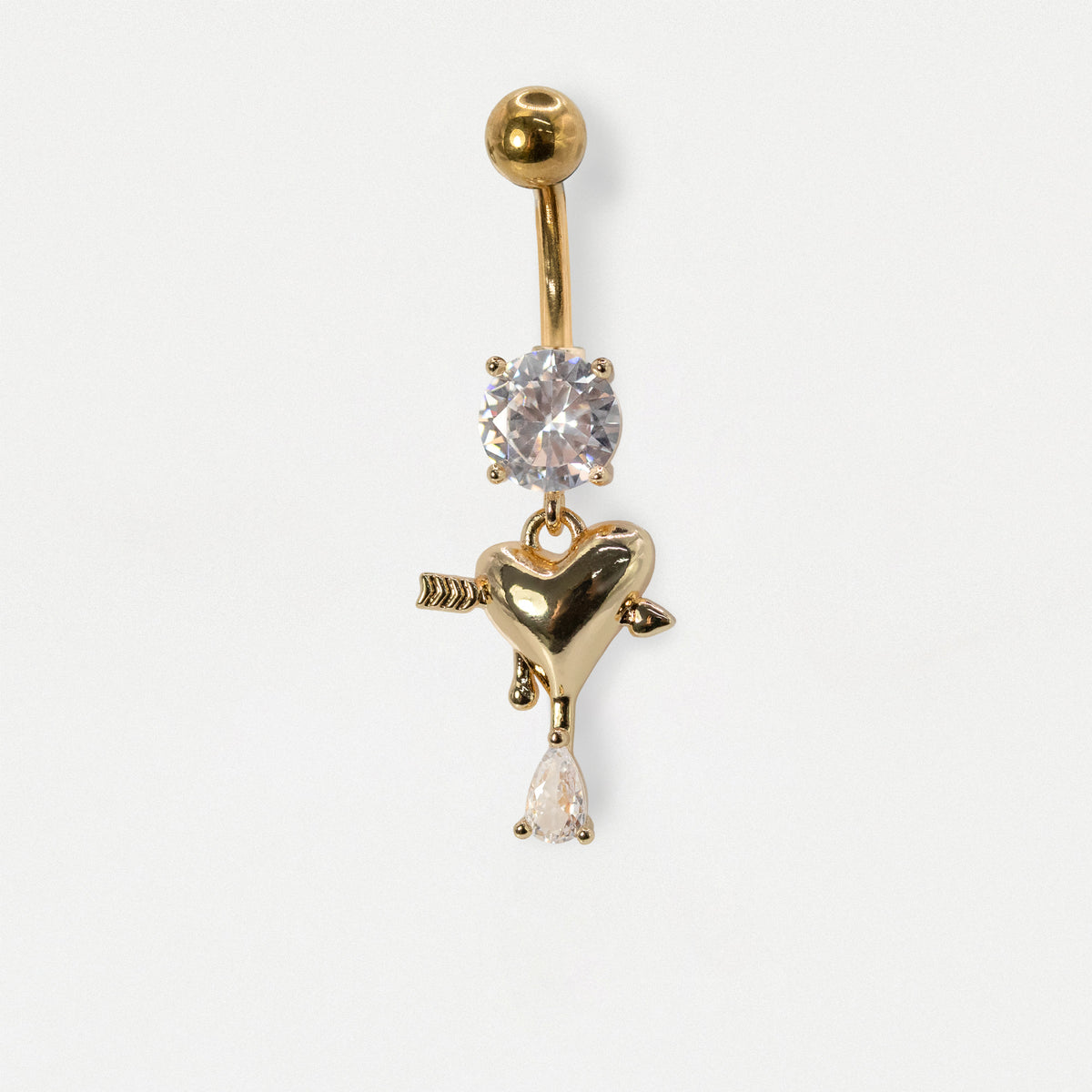 A Gold PVD Steel belly bar with a round clear crystal gemstone and an arrow-pierced heart dangle with a pear crystal drop by Kingsley Ryan Wholesale