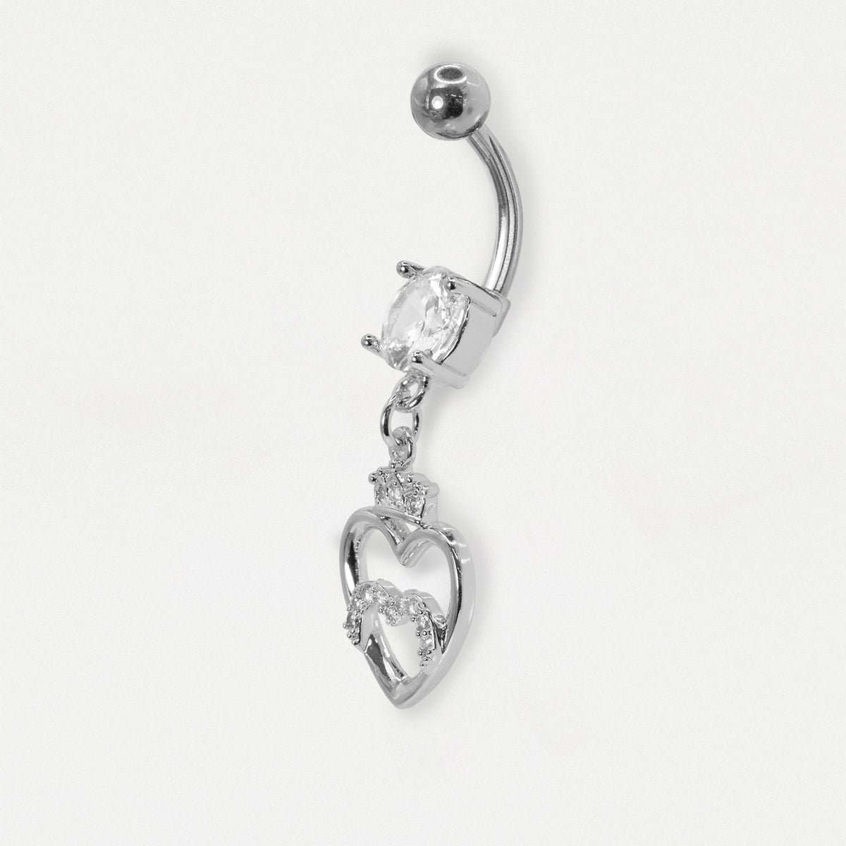 A steel navel bar on its side showing the curved bar set with a clear crystal and a dangling open heart design with a small crown