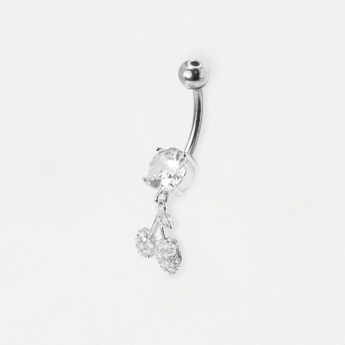 A steel curved barbell belly button ring with a large clear faceted stone and two dangling clear crystal charms, shown on a plain light gray background.