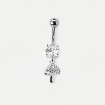 A silver-toned belly button ring featuring a round clear gemstone and a dangling tree charm set with small clear stones, shown on a plain light gray background.
