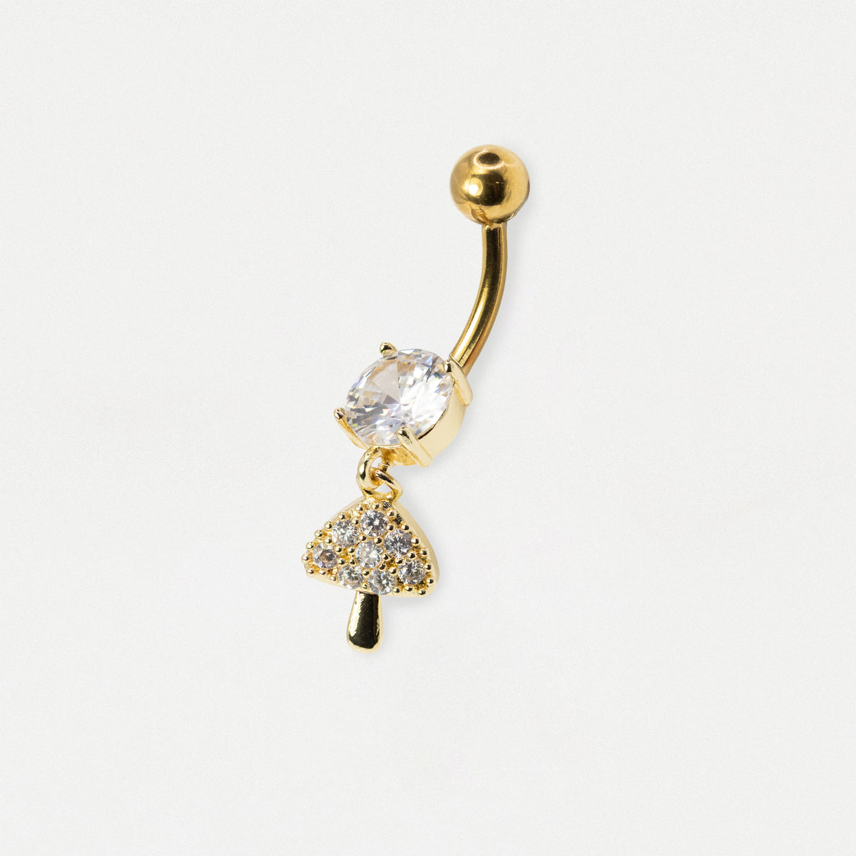 Gold-plated Steel curved barbell belly button ring with a clear faceted gemstone and a dangling mushroom charm, shown on a plain white background.