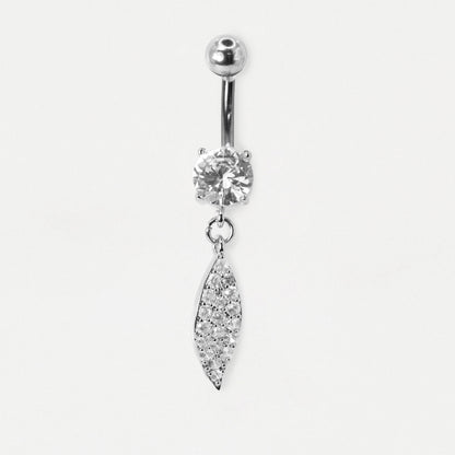 A Steel belly bar featuring a claw-set round clear crystal and a dangling leaf-shaped charm fully pavé-set with clear crystals by Kingsley Ryan Wholesale on a pale grey background