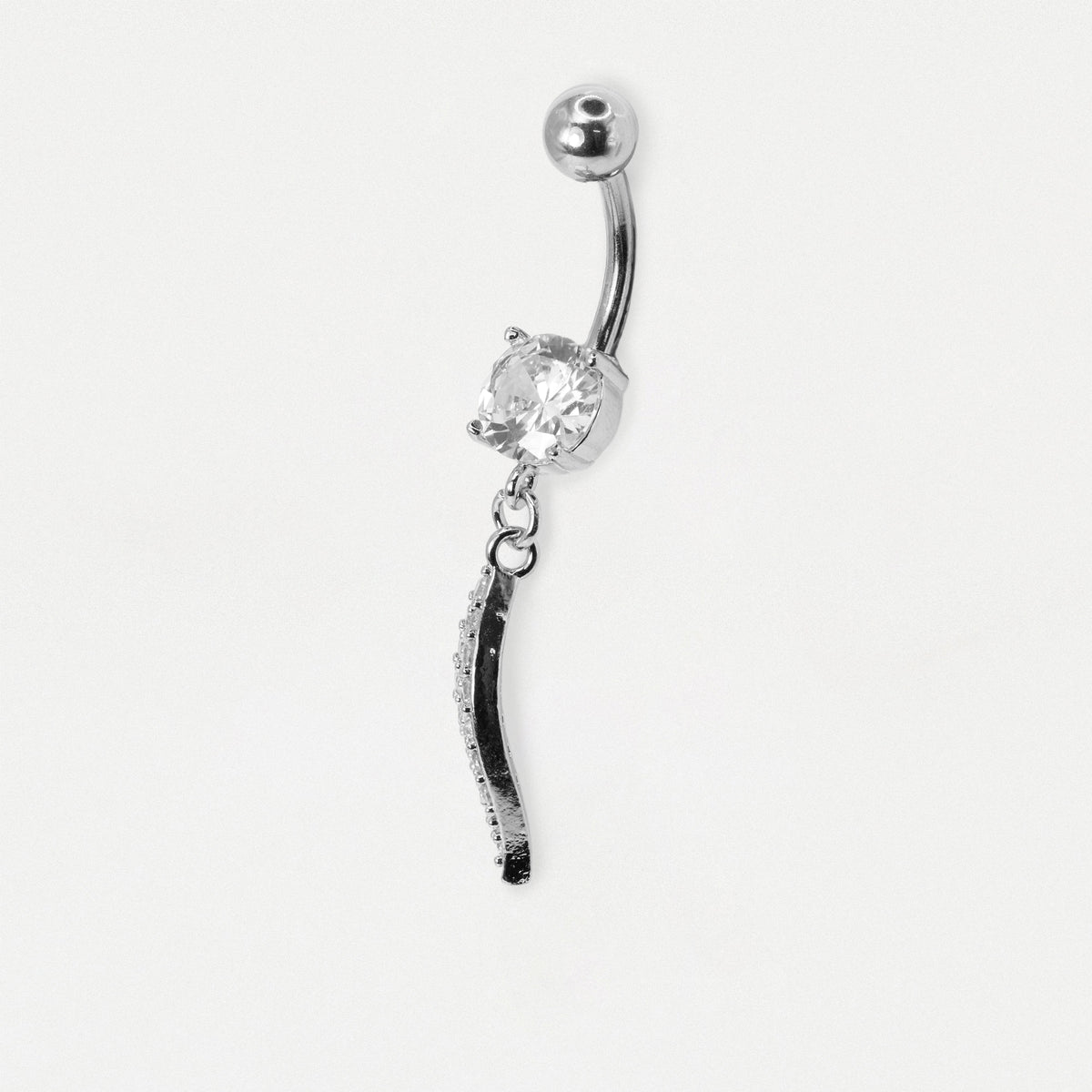 A silver-toned belly button ring featuring a curved barbell, a clear faceted gemstone, and a dangling black-and-silver textured charm, shown on a plain light gray background.