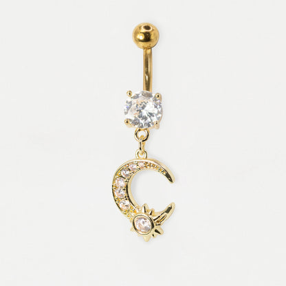 Gold-tone belly button ring with a ball top, a clear rhinestone-set oval charm, and a dangling crescent moon and star charm embellished with small clear stones, on a white background.