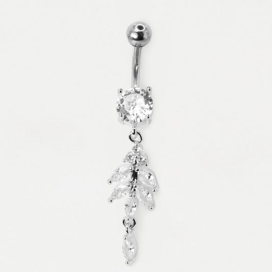 The images shows a  Steel belly bar featuring a round clear crystal and a 15mm dangling botanical vine charm with marquise crystal leaves and a small teardrop by Kingsley Ryan Wholesale