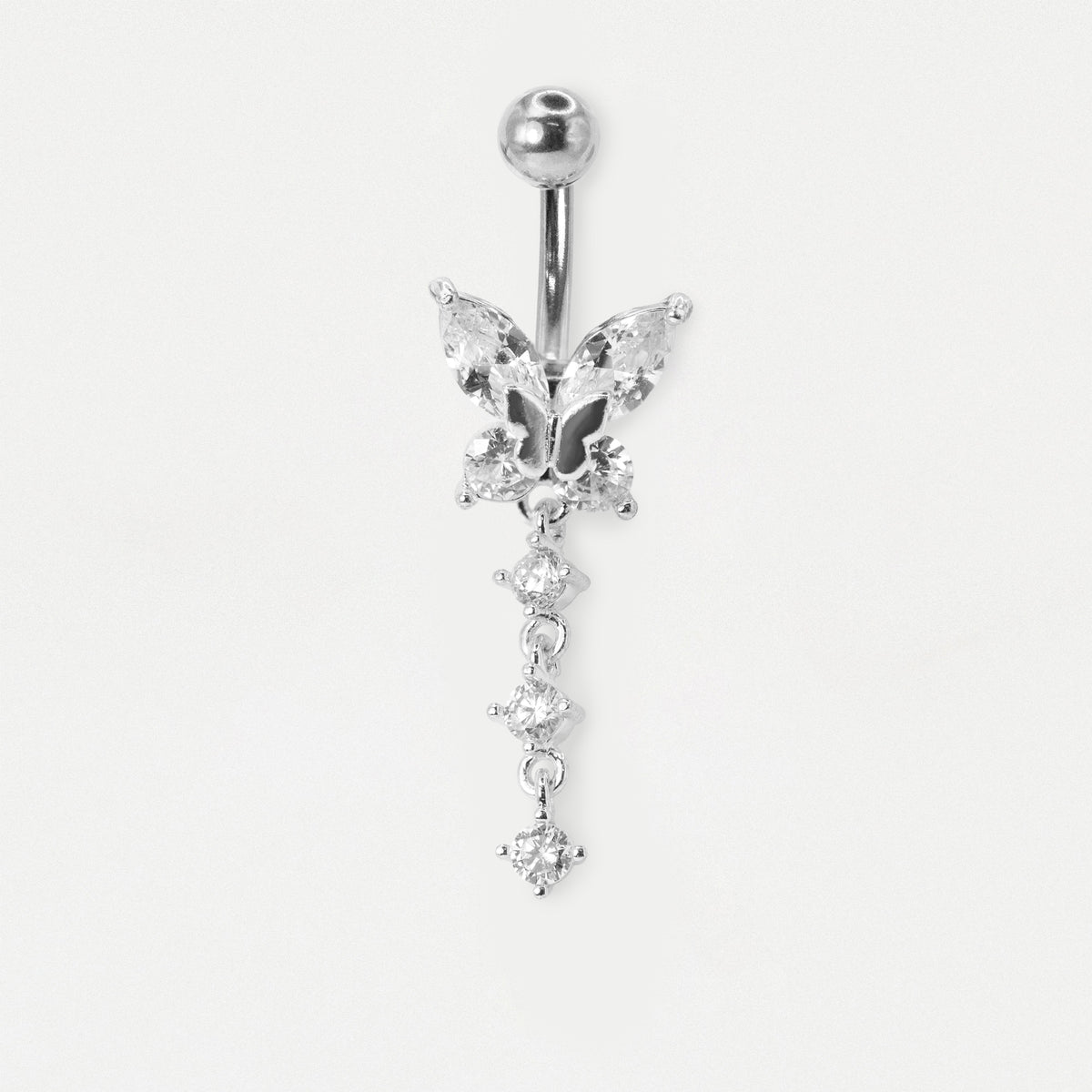 The image shows a  Steel belly bar featuring a crystal butterfly design with marquise and round stones and a dangling 3-stone clear crystal line by Kingsley Ryan Wholesale