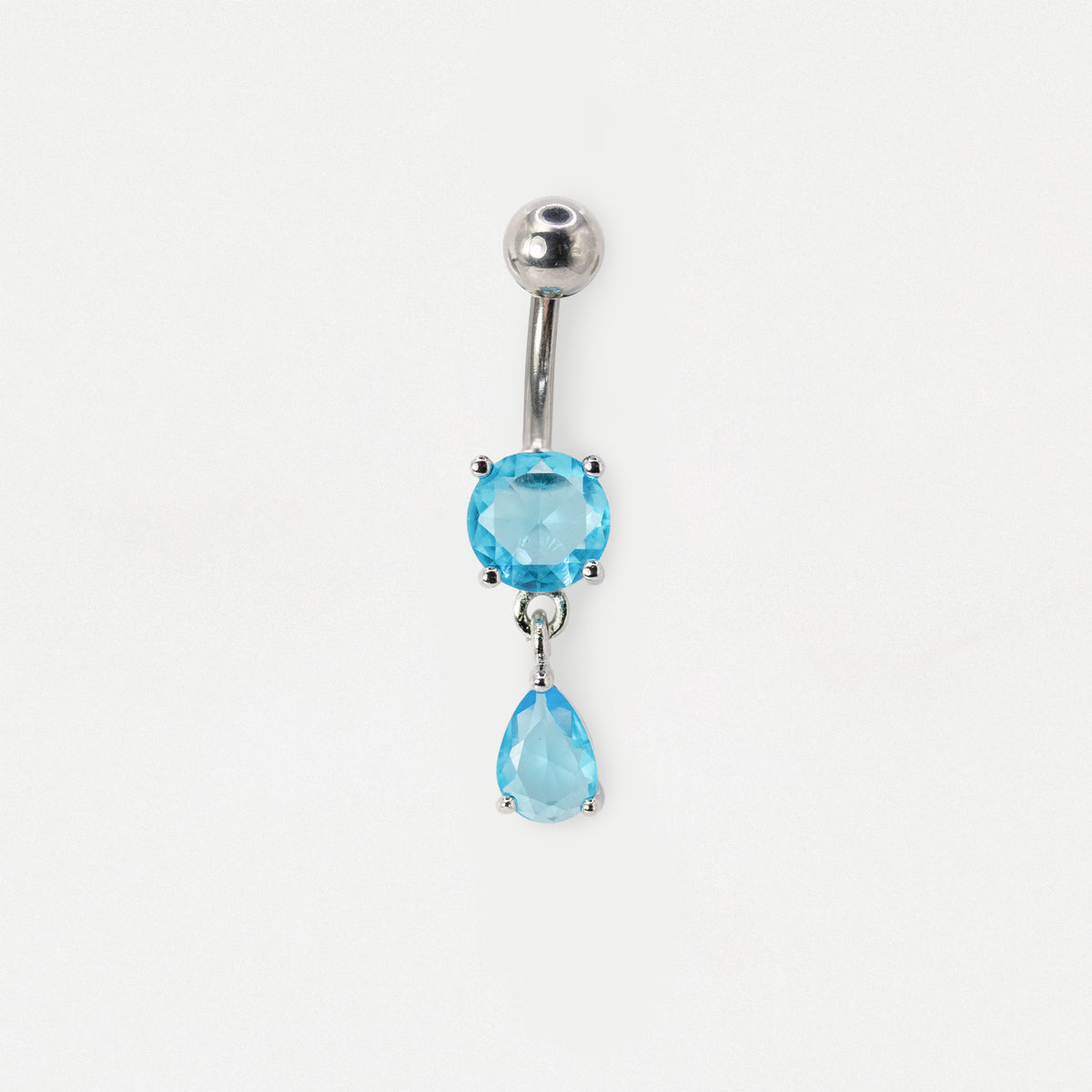 A silver-toned belly button ring featuring a round light blue gemstone and a dangling teardrop-shaped light blue gemstone, shown on a plain white background.