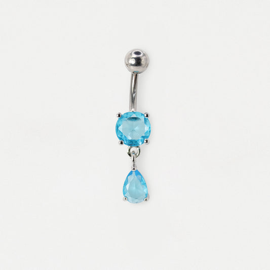A silver-toned belly button ring featuring a round light blue gemstone and a dangling teardrop-shaped light blue gemstone, shown on a plain white background.