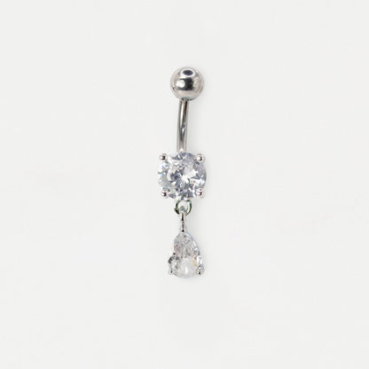 A silver-toned belly button ring featuring a round bezel-set clear crystal and a dangling pear-cut clear crystal, shown on a plain white background.